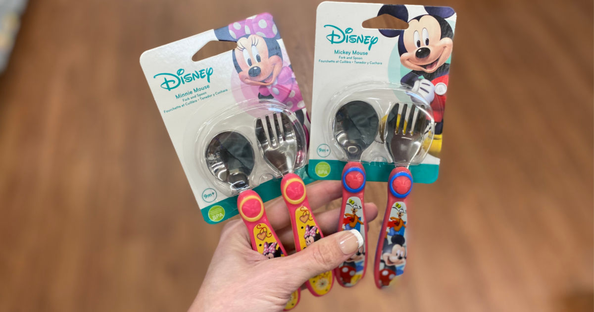 hand holding Mickey Mouse and Goofy Silver Ware for Kids