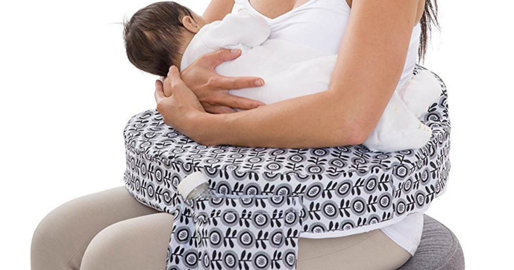 woman using a My Brest Friend Nursing Pillow while nursing a baby