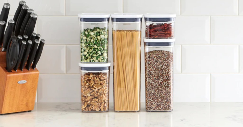OXO Pop 5-Piece Food Storage Container Set with pasta, nuts, grains, and more inside
