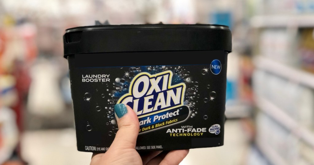 OxiClean Dark Protect in hand at store
