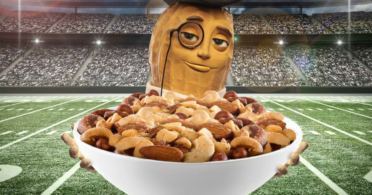 Mr. Peanut holding a bowl of mixed nuts