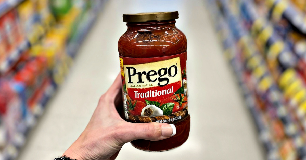 Prego Sauce jar in woman's hand at store