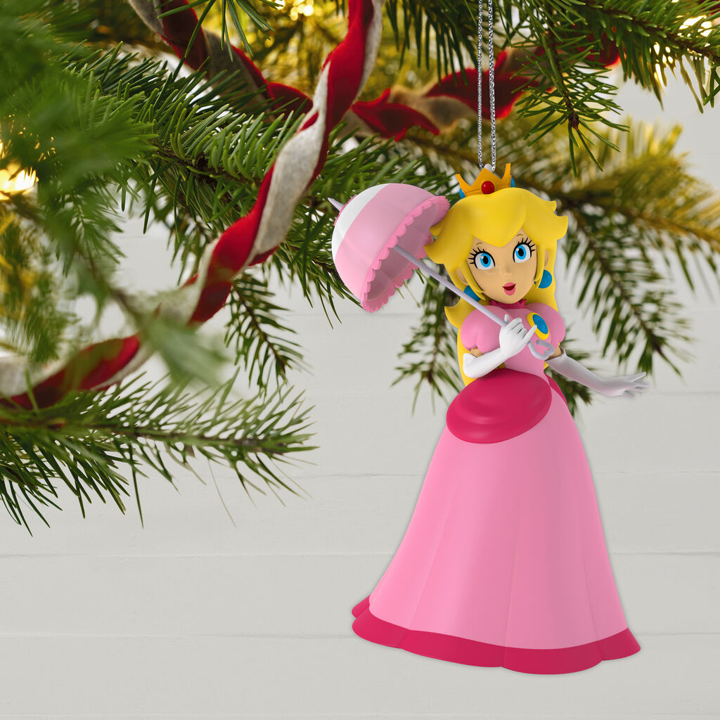 Princess Peach Ornament hanging on tree