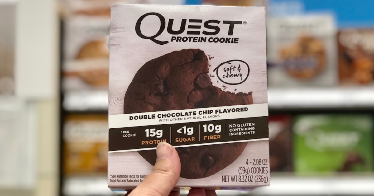 woman hand holding Quest Nutrition Double Chocolate Chip Protein Cookie in store