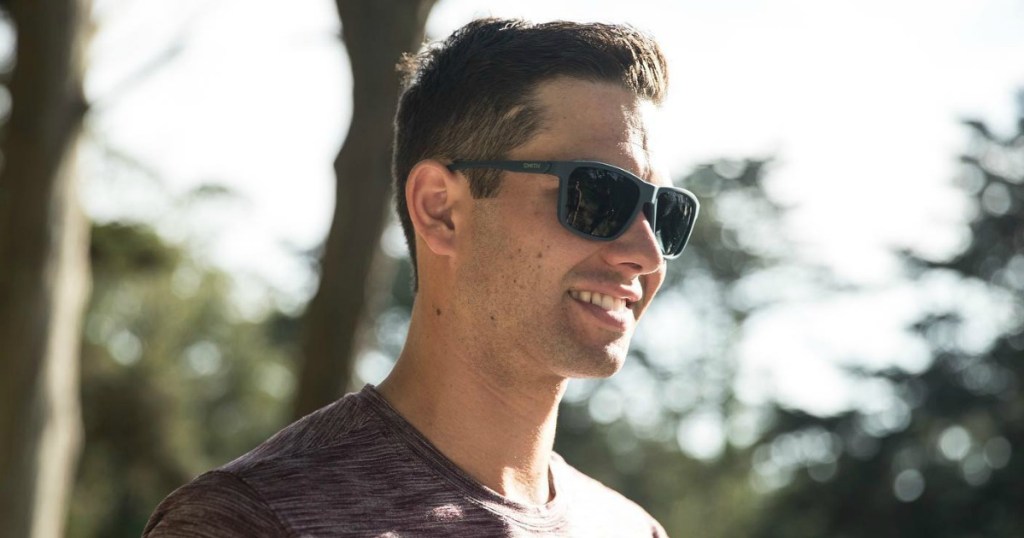 man in a t-shirt wearing sunglasses outside