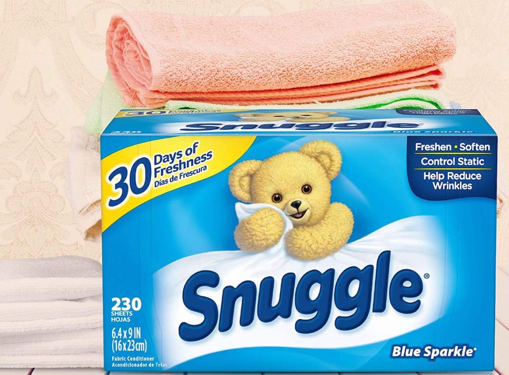 Snuggle Blue Sparkle Dryer Sheets sitting in front of stack of towels