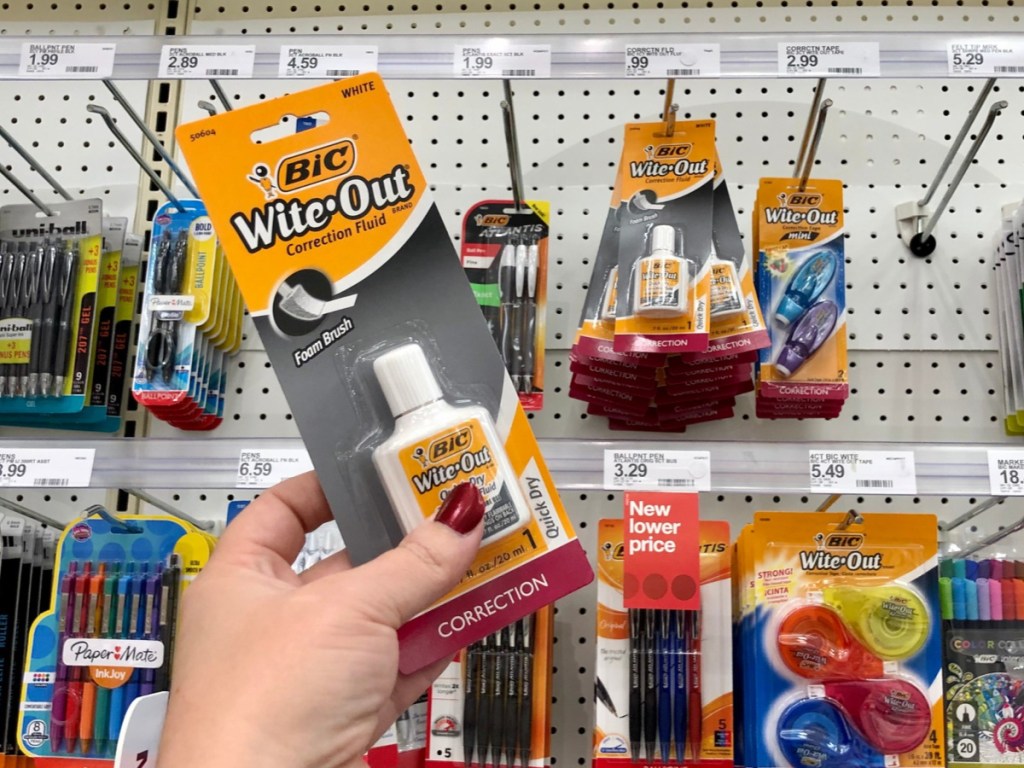 Woman's Hand holding BIC wite out at target