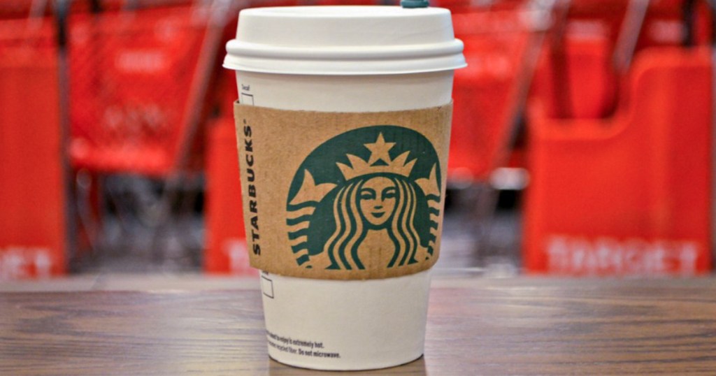 Starbucks beverage with Target carts in background