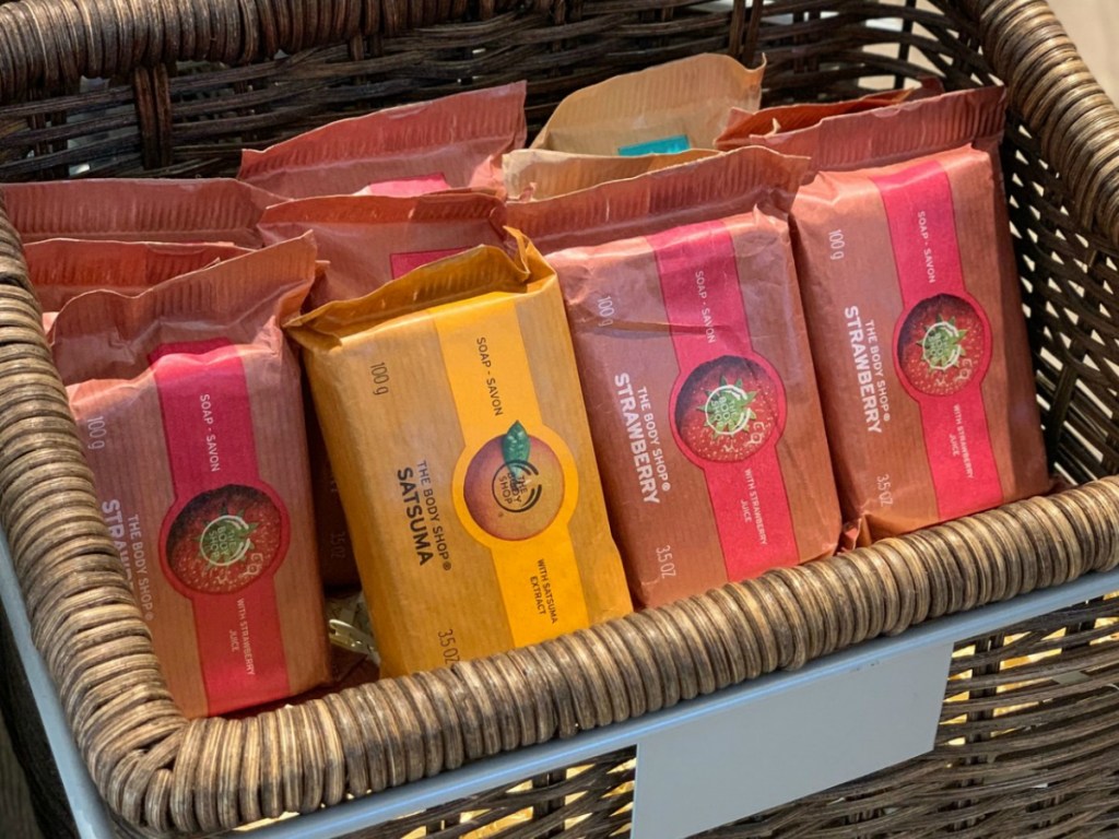 Various scents of soap bars on display in package in a basket