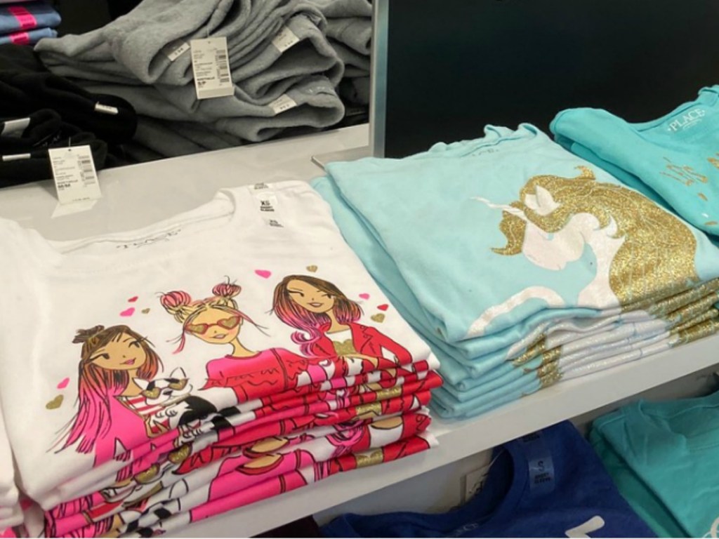 In-store display of girls graphic tees
