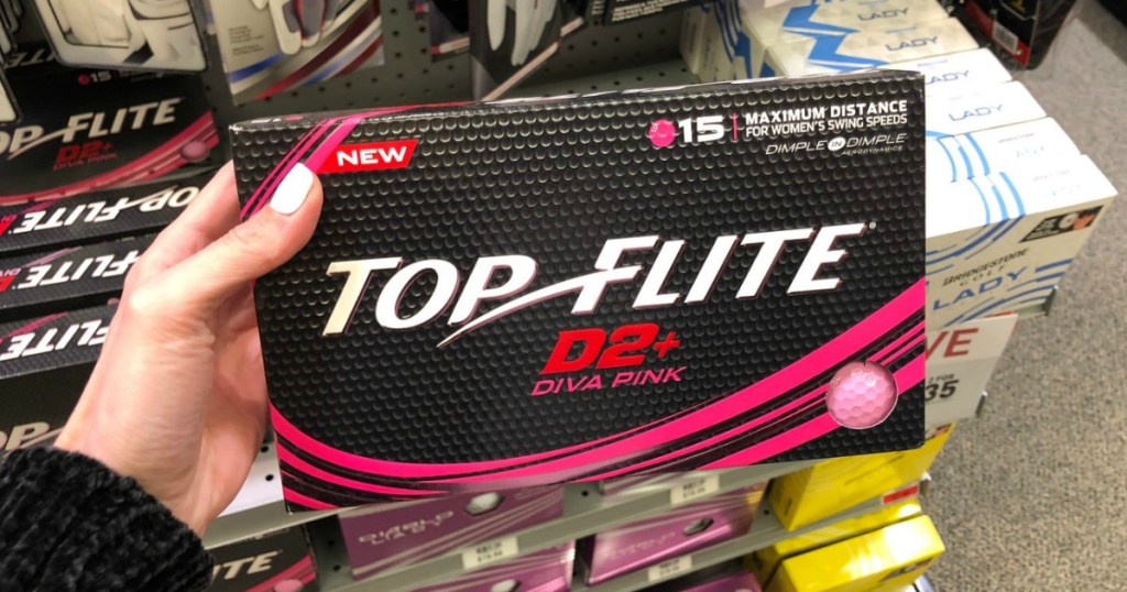 Box of Top Flite Women's D2+ Diva Pink Golf Balls in hand in store