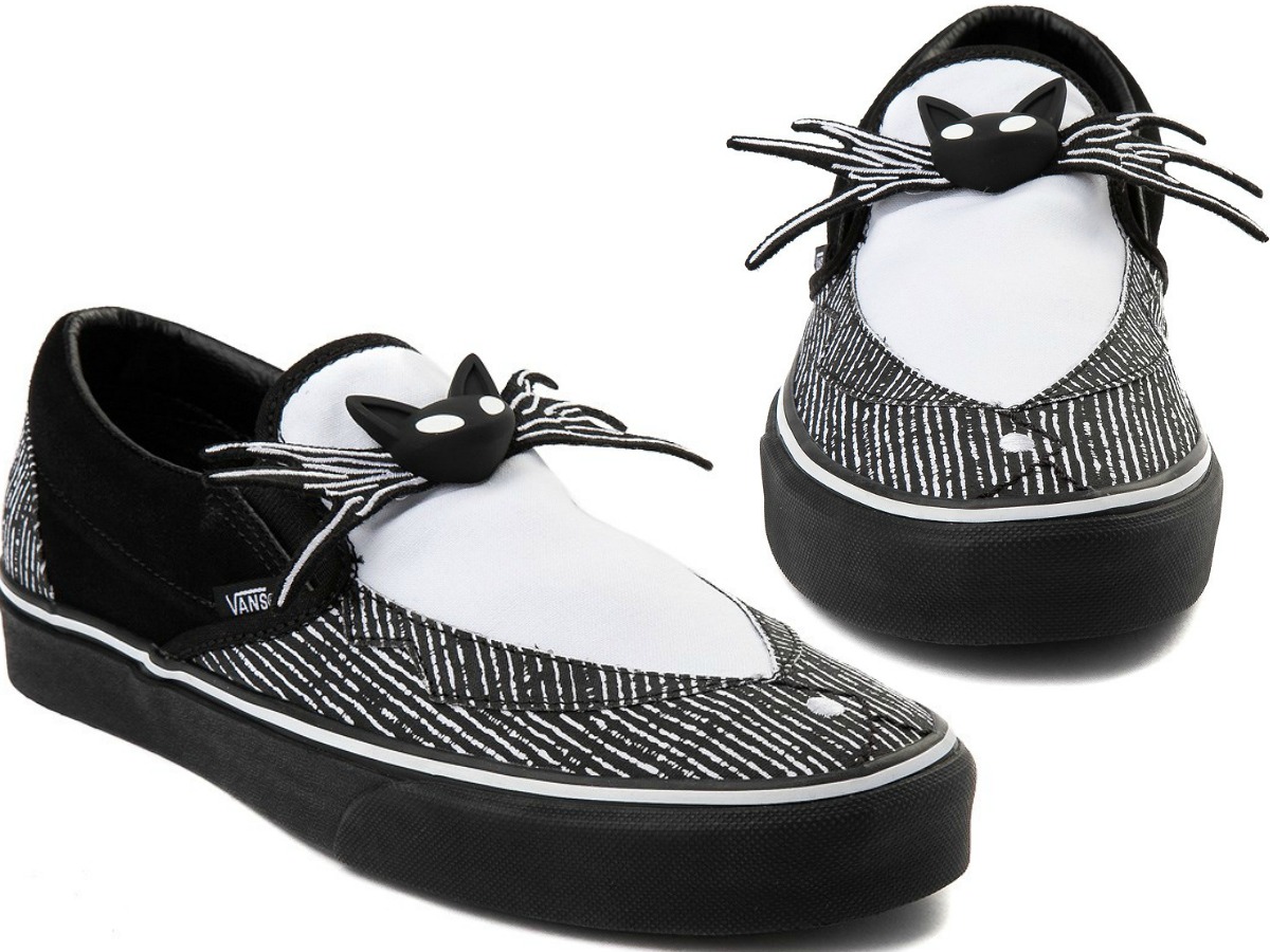 pair of shoes with black and white and spider legs with cat face appliques