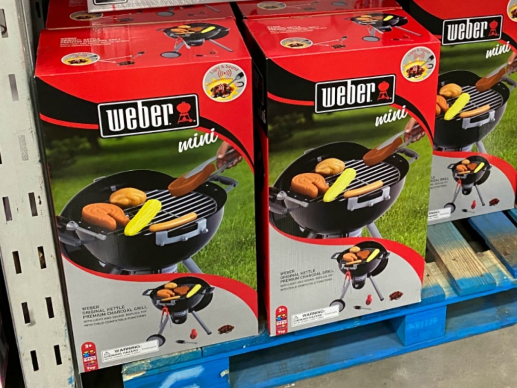 In-store display of Weber toy grills in boxes
