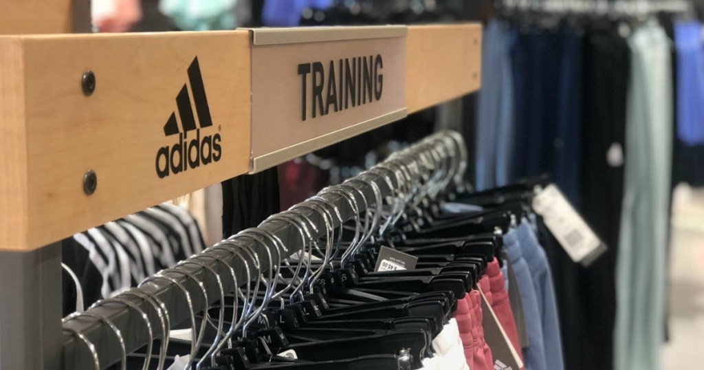 In-store rack of men's and women's adidas training pants