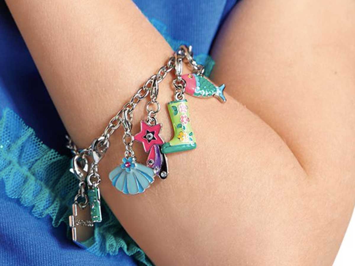 girl wearing an American Girl Charm bracelet