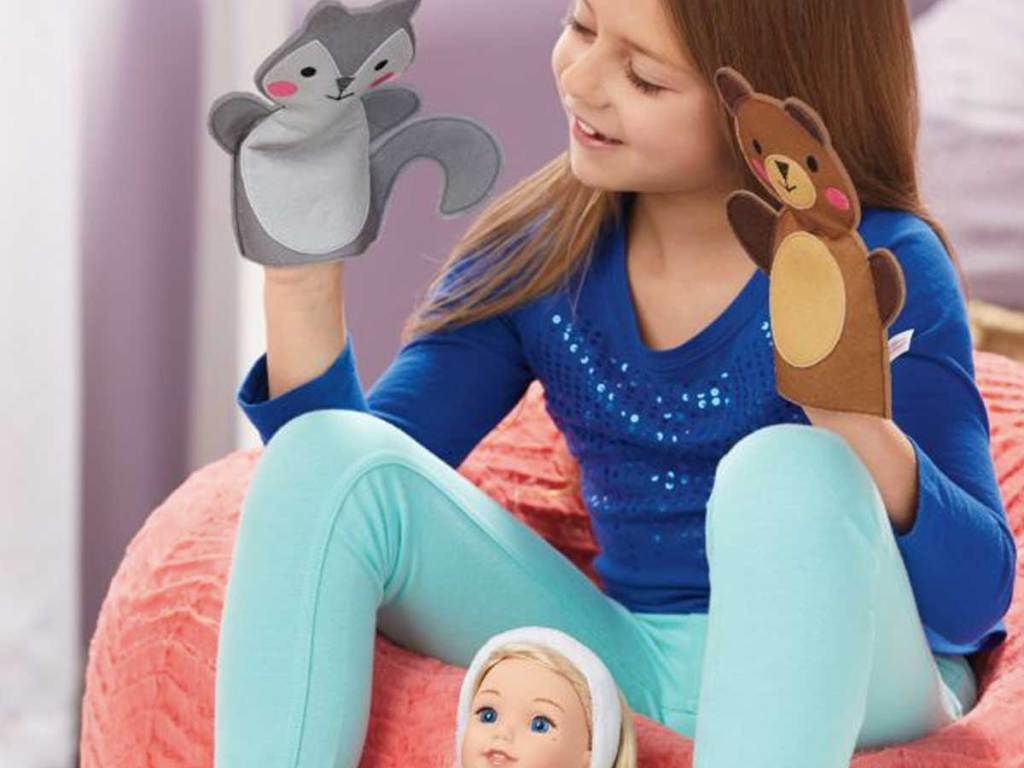 girl playing with Story Puppets for Girls and her american girl doll