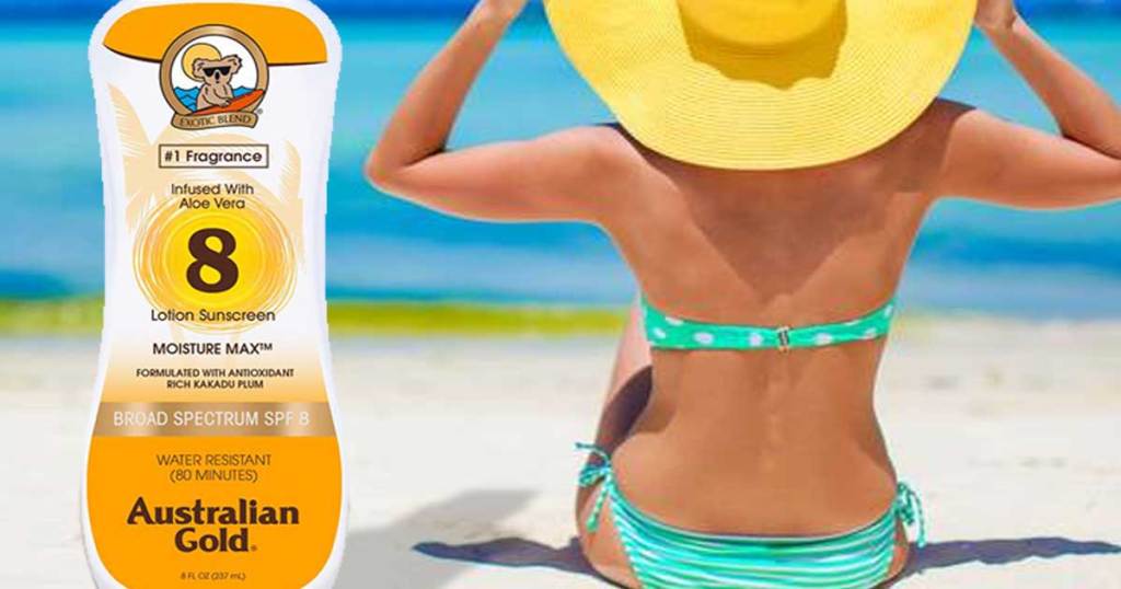 woman on a beach with a bottle of Australian Gold SPF 8 Sunscreen Lotion