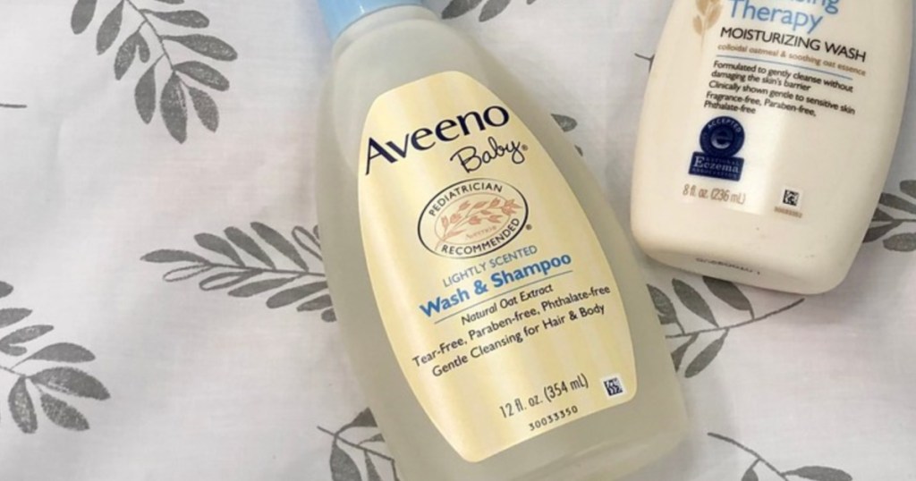 bottle of Aveeno baby wash on a blanket