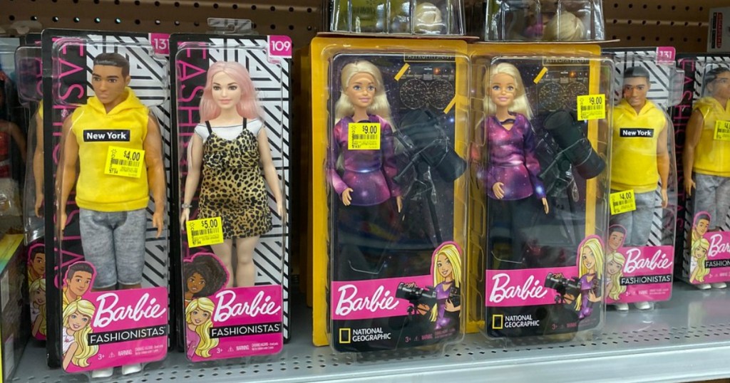 store shelf with dolls and price tags on it