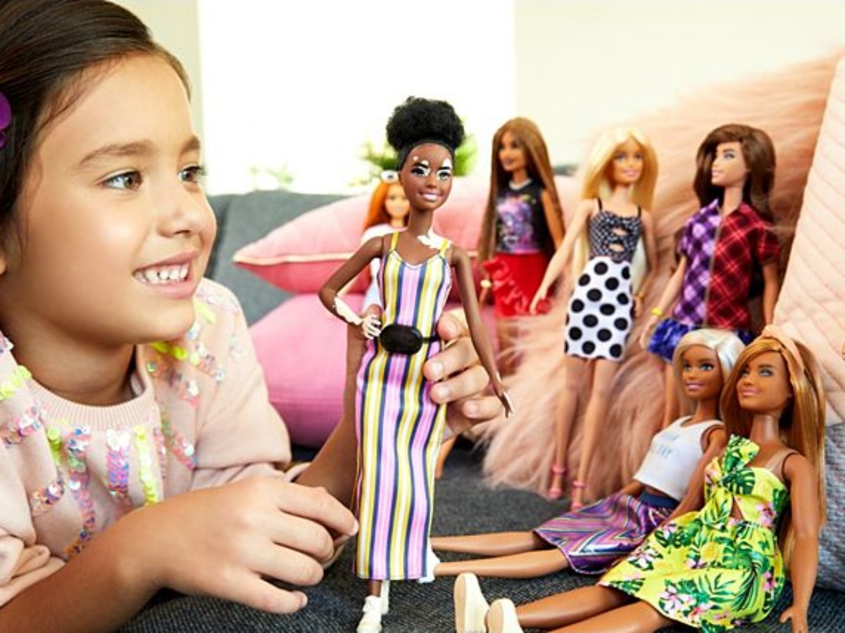 people playing with barbies