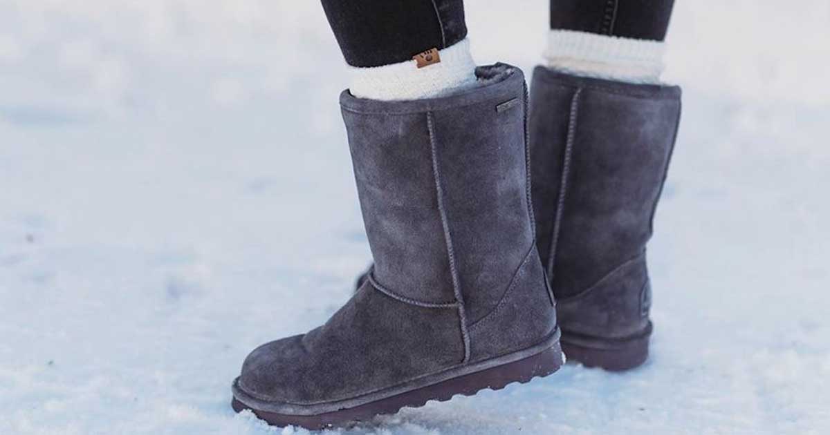 woman wearing Bearpaw Women's Elle Short Boots in the snow