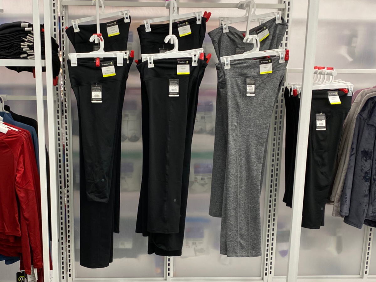 grey and black workout pants hanging in store