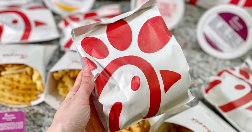 hand holding Chick-fil-A bag