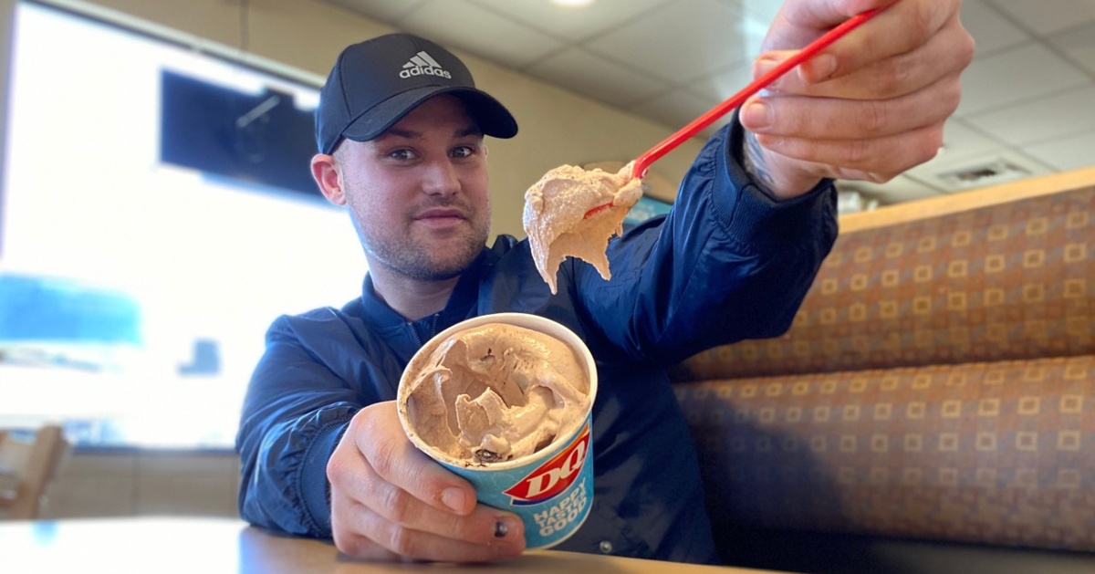 man with red spoon and DQ Blizzard treat