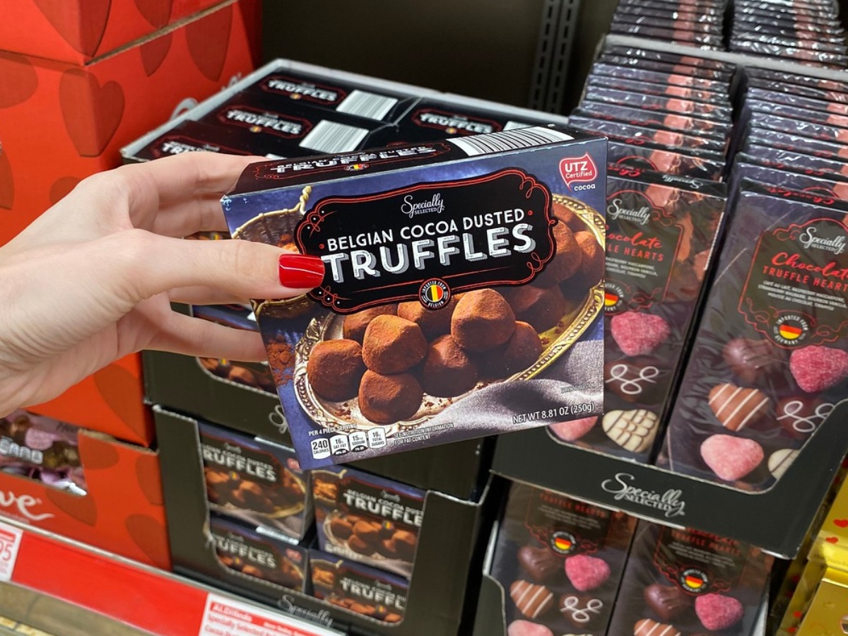 hand holding box of chocolate truffles