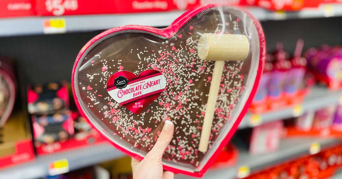 woman's hand holding a Sam's Choice Chocolate Heartbreaker bark and mallet in store