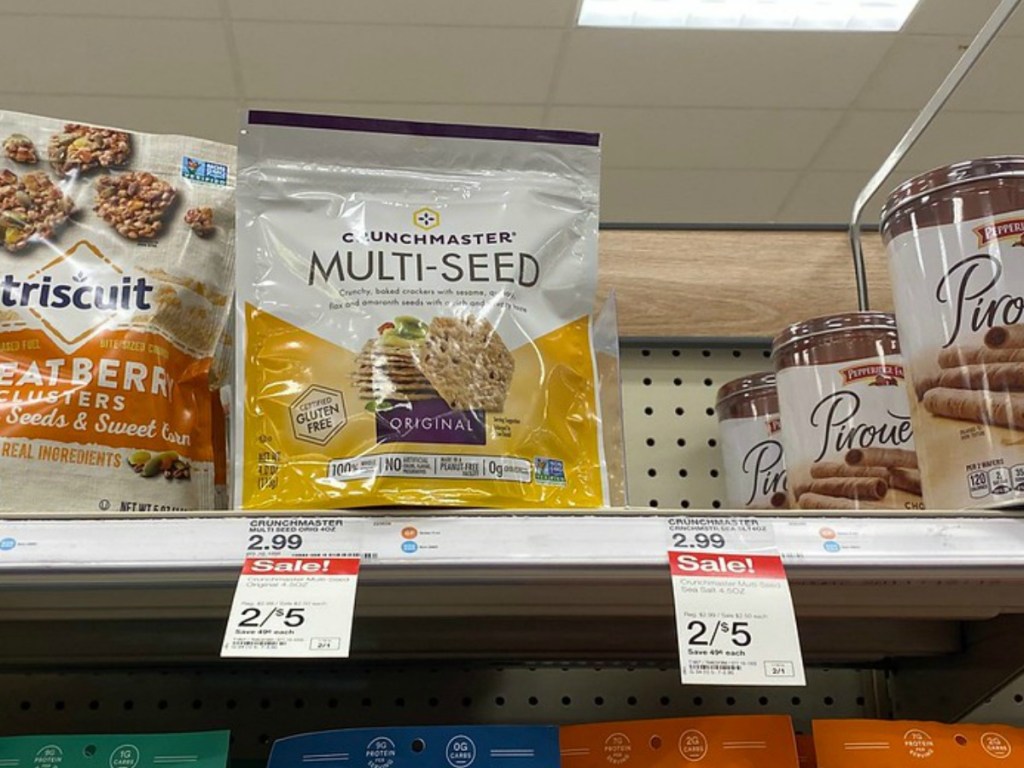 store shelf with crackers in bags and price tags