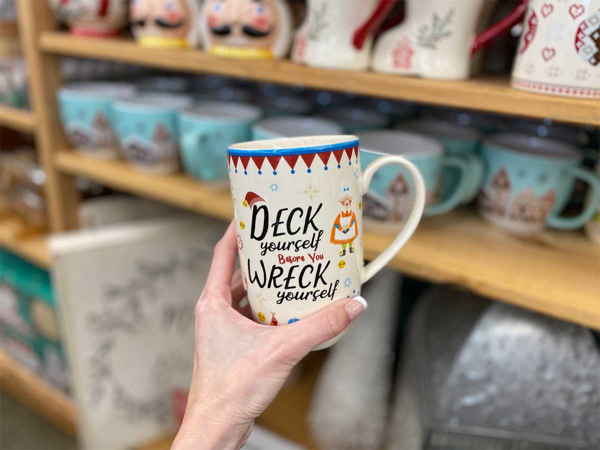 hand holding Deck Yourself Before Your Wreck Yourself Mug