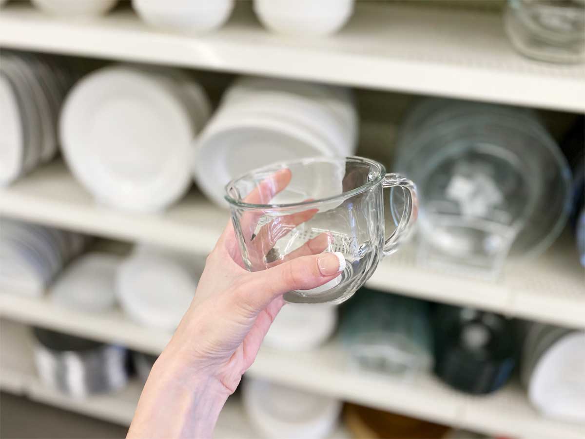 hand holding Clear Glass 18 oz Mugs