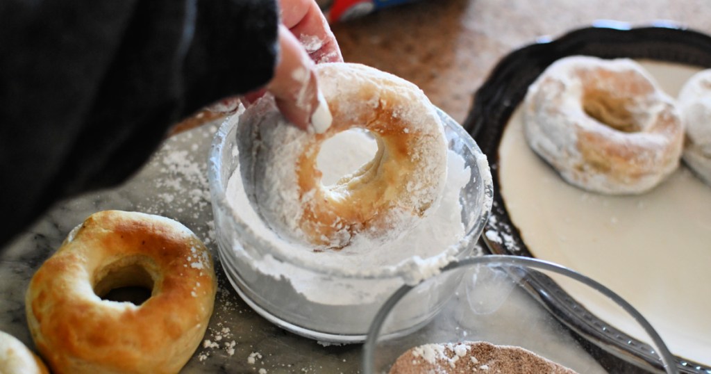 dunking donuts in powdered sugar