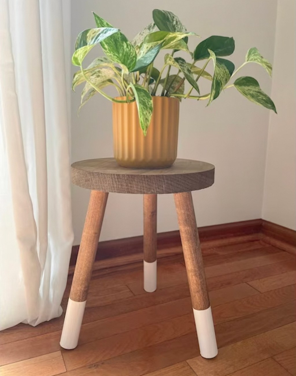 wood white dipped stool with planter on top