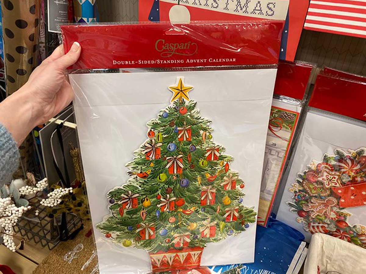 woman holding Christmas Tree Advent Calendar package