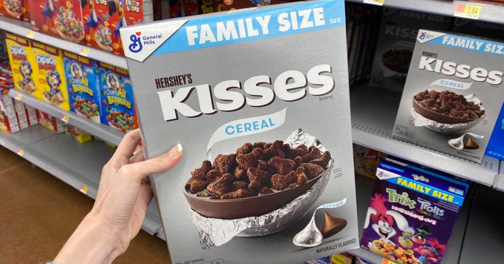 hand holding box of General Mills Hershey's Kisses Cereal at Walmart