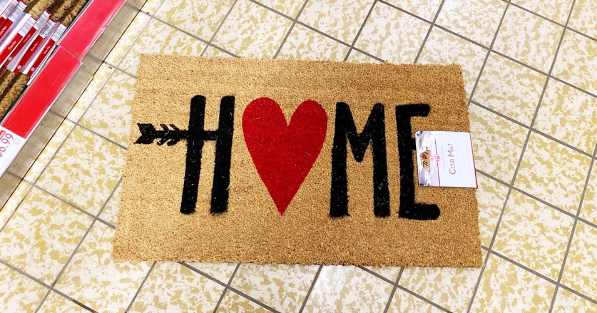 coir doormat with the word "home" and a heart