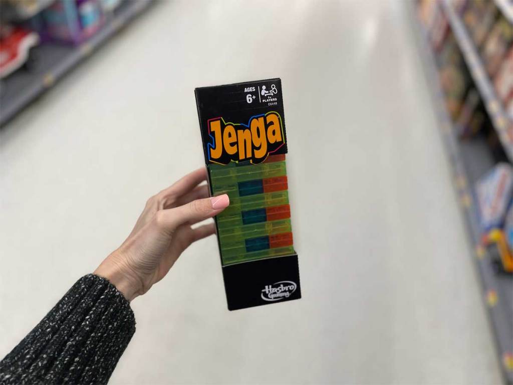 woman holding jenga neon pop game