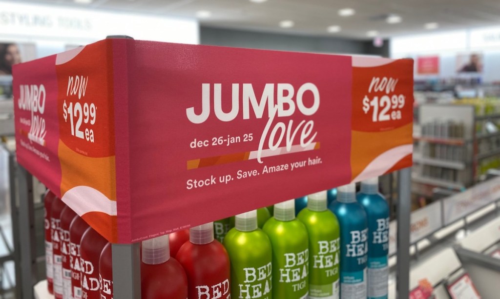 jumbo love ulta sale sign in store with red green and blue bed head hair care products