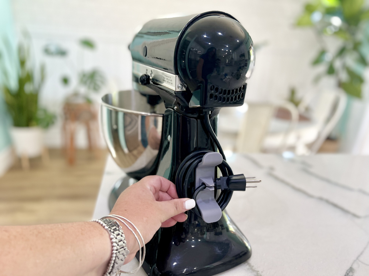 kitchenAid mixer with a cord organizer which is one of our favorite pantry organization ideas for 2024