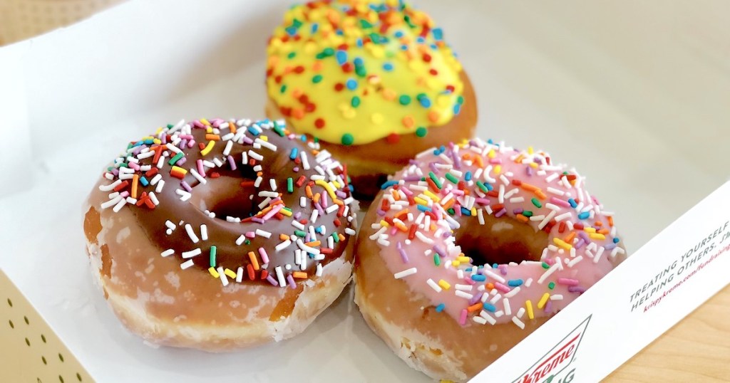 sprinkled donuts sitting in box 