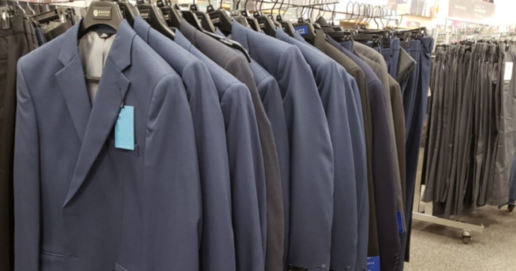 Men's suit coats hanging on rack in department store