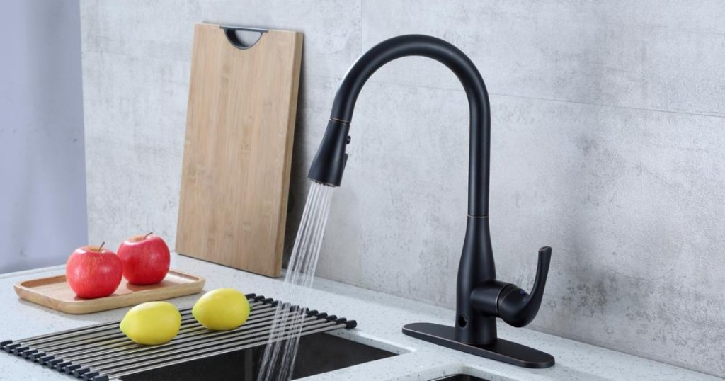 Oil-rubbed bronze kitchen faucet with running water