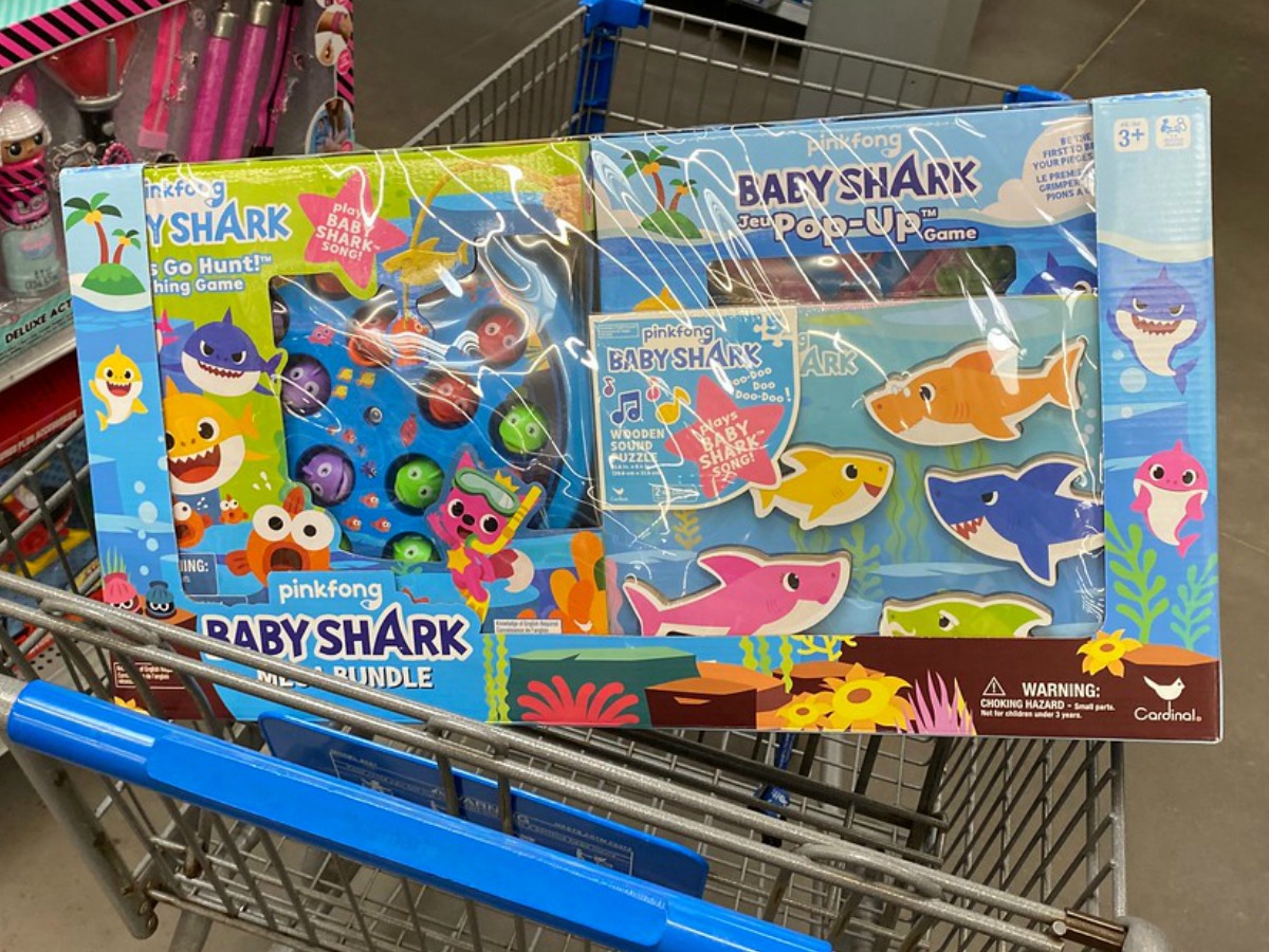 grocery cart with toy set that has baby sharks in it