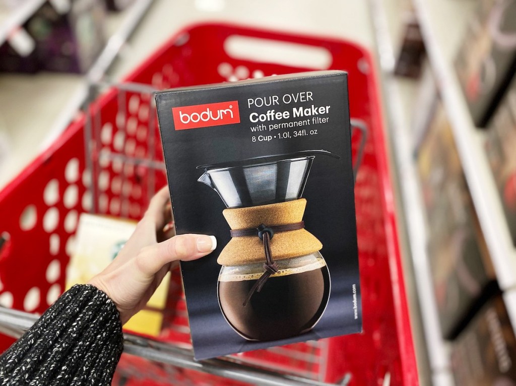 hand holding a box of bodum pour over coffee maker with target cart