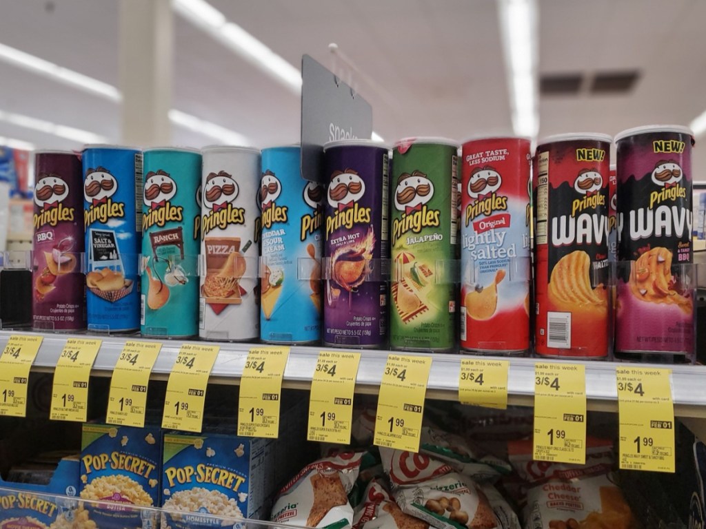 pringles cans on shelf at store with sale price tags below cans