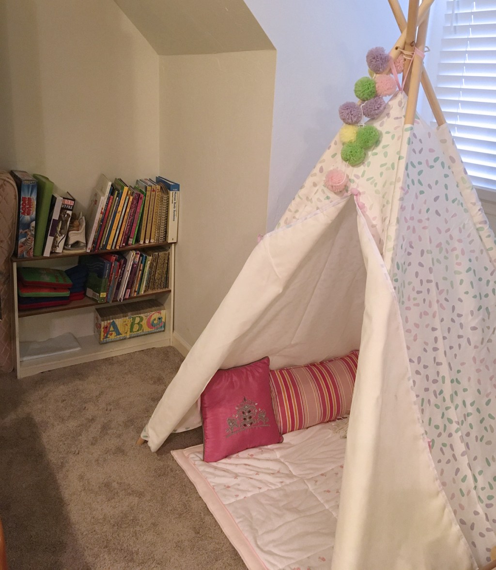 child's play tent and book shelves