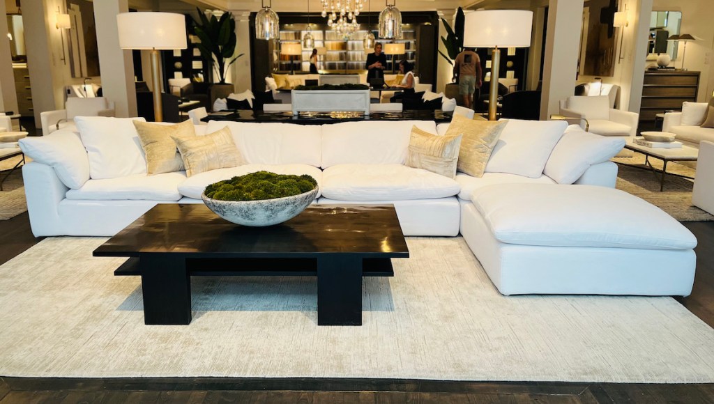 white restoration hardware cloud couch in retail store
