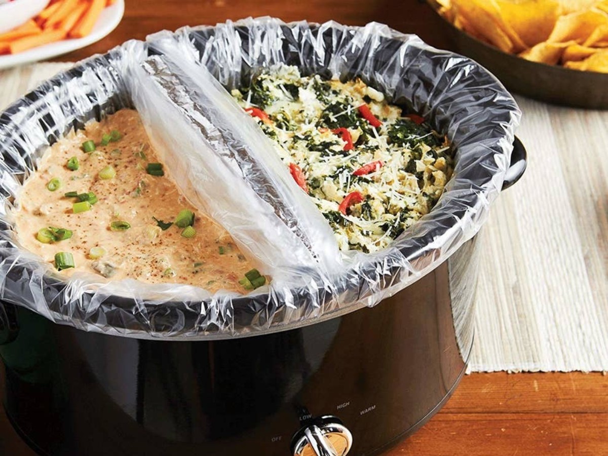 oval slow cooker divided by clear liners - gameday food tailgating recipes